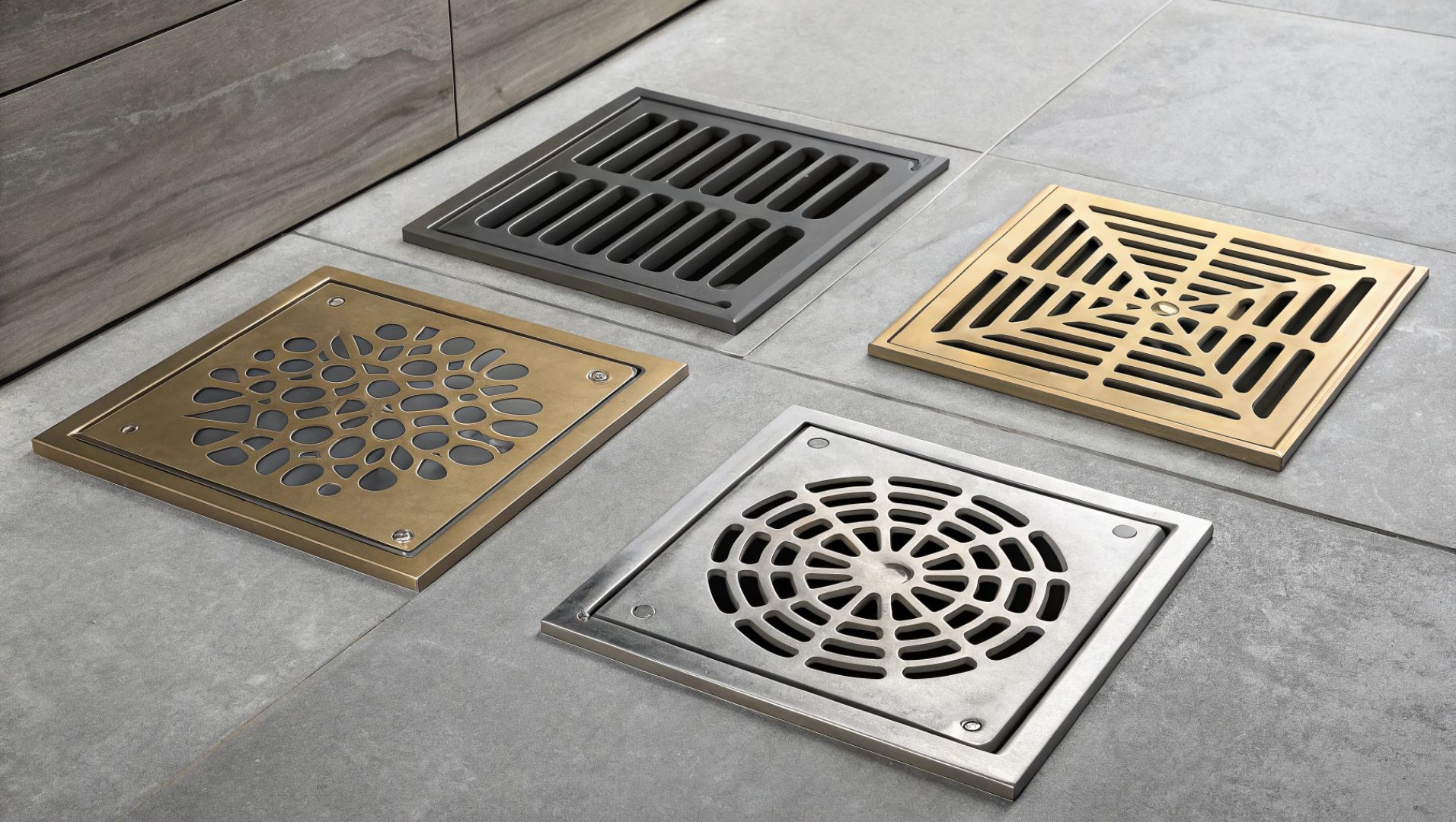Floor Drain Materials Comparison Various floor drain materials including stainless steel, brass, PVC, and cast iron displayed together.