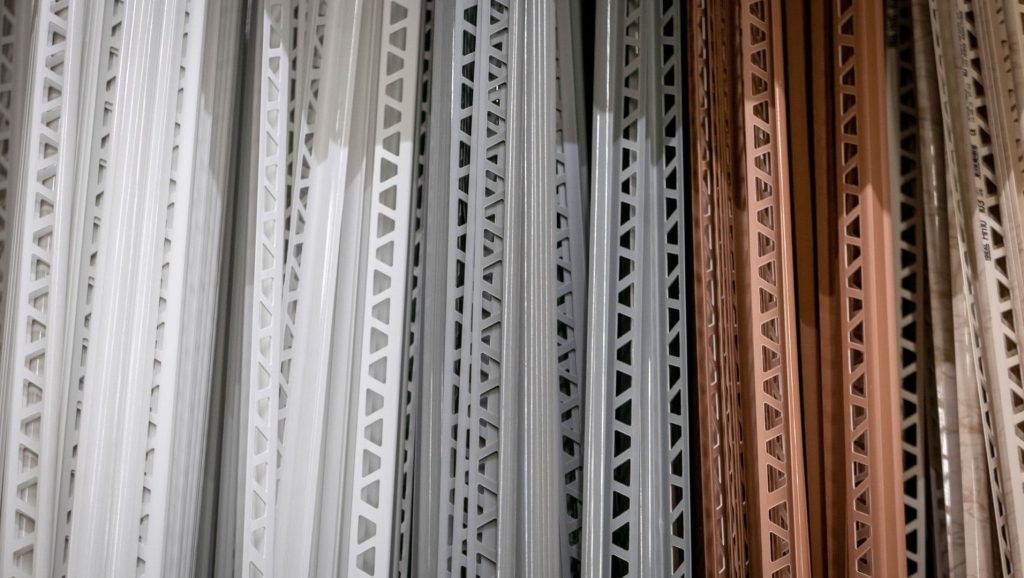 Various tile trims on a wooden surface