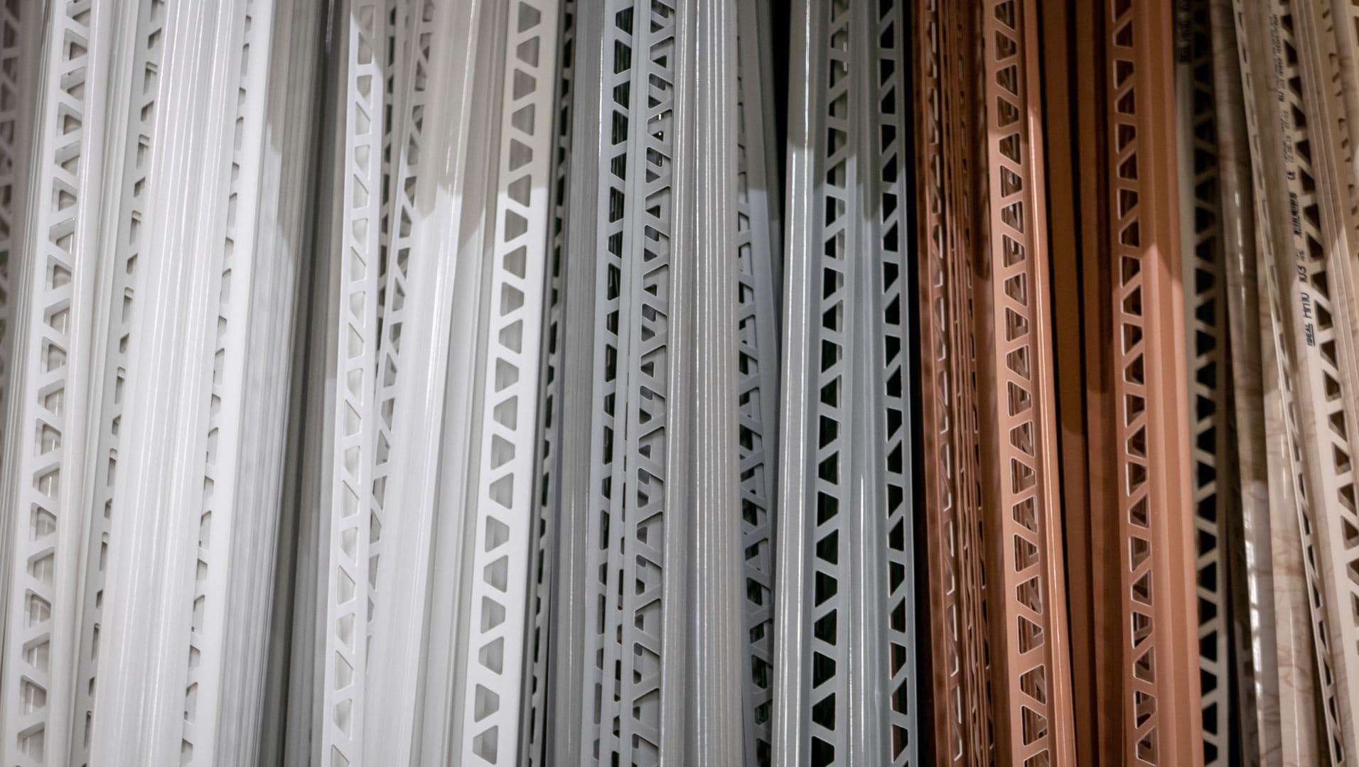 Various tile trims on a wooden surface