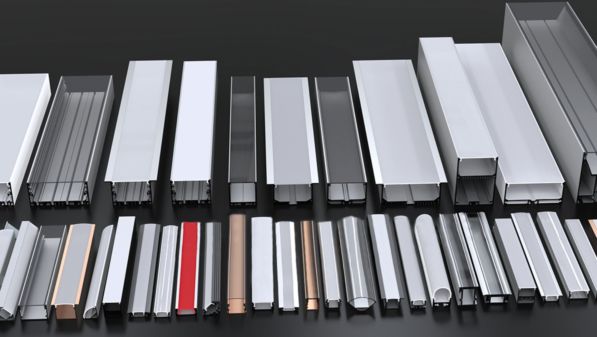 Various types of aluminium LED profiles displayed on a wooden surface