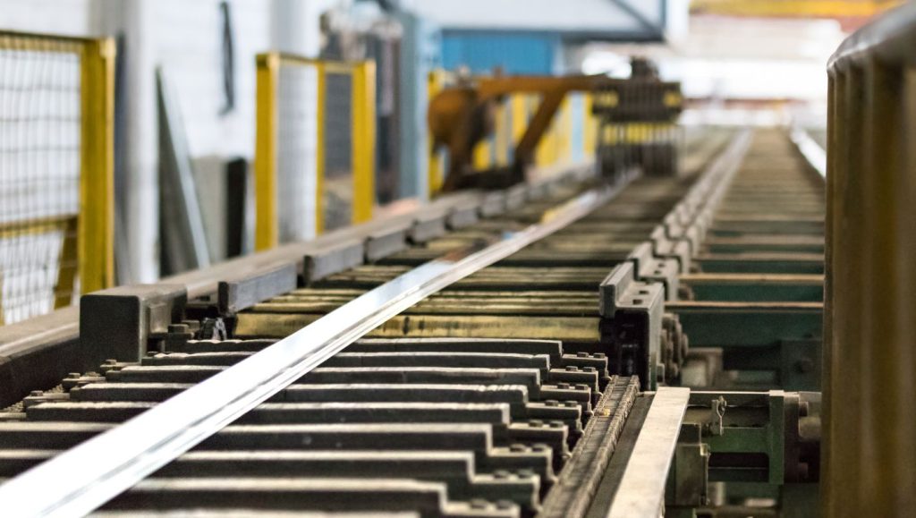 Industrial aluminum extrusion process in a factory