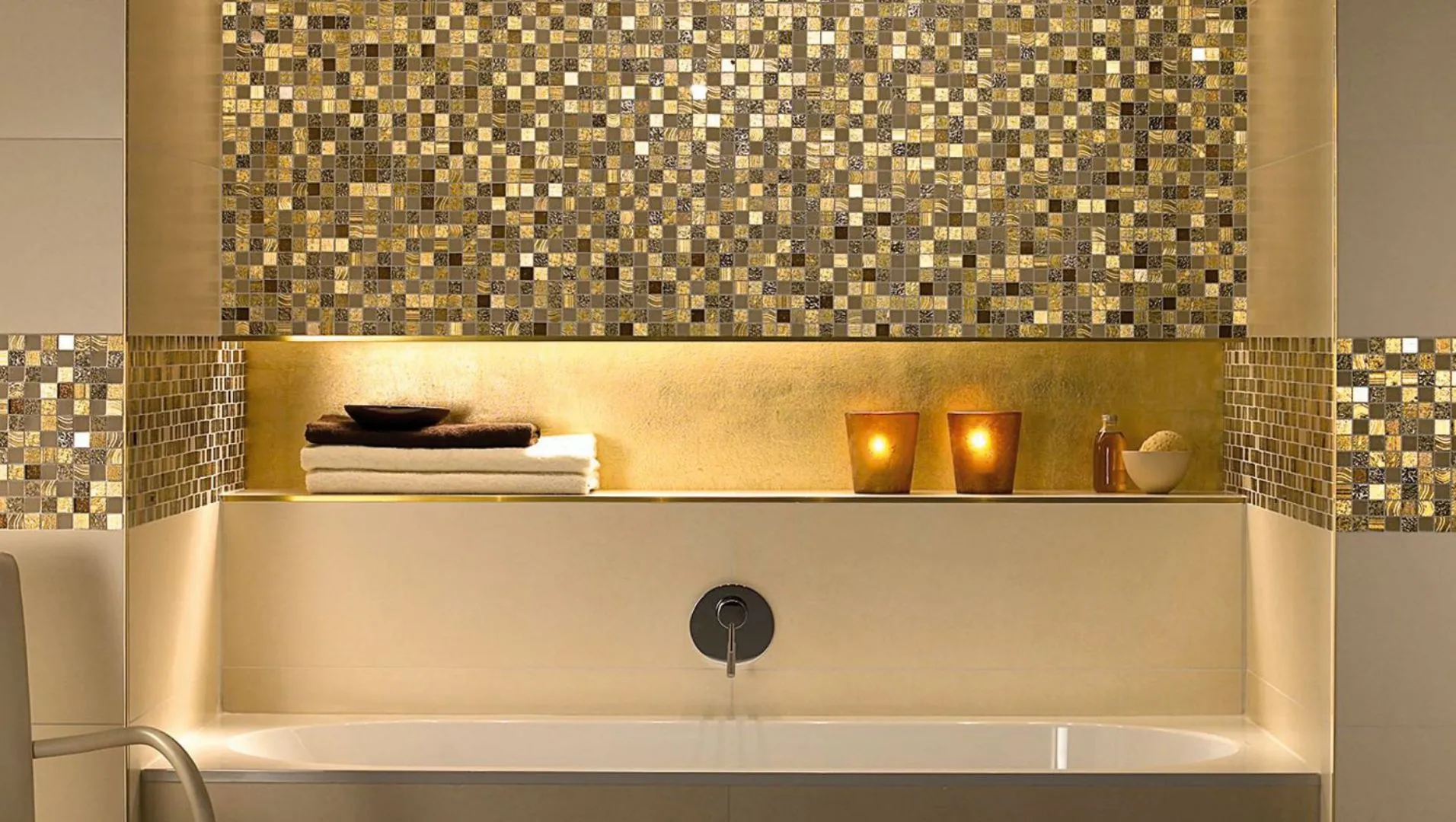 Elegant bathroom with shiny brass tile trim, showcasing cleanliness and polish