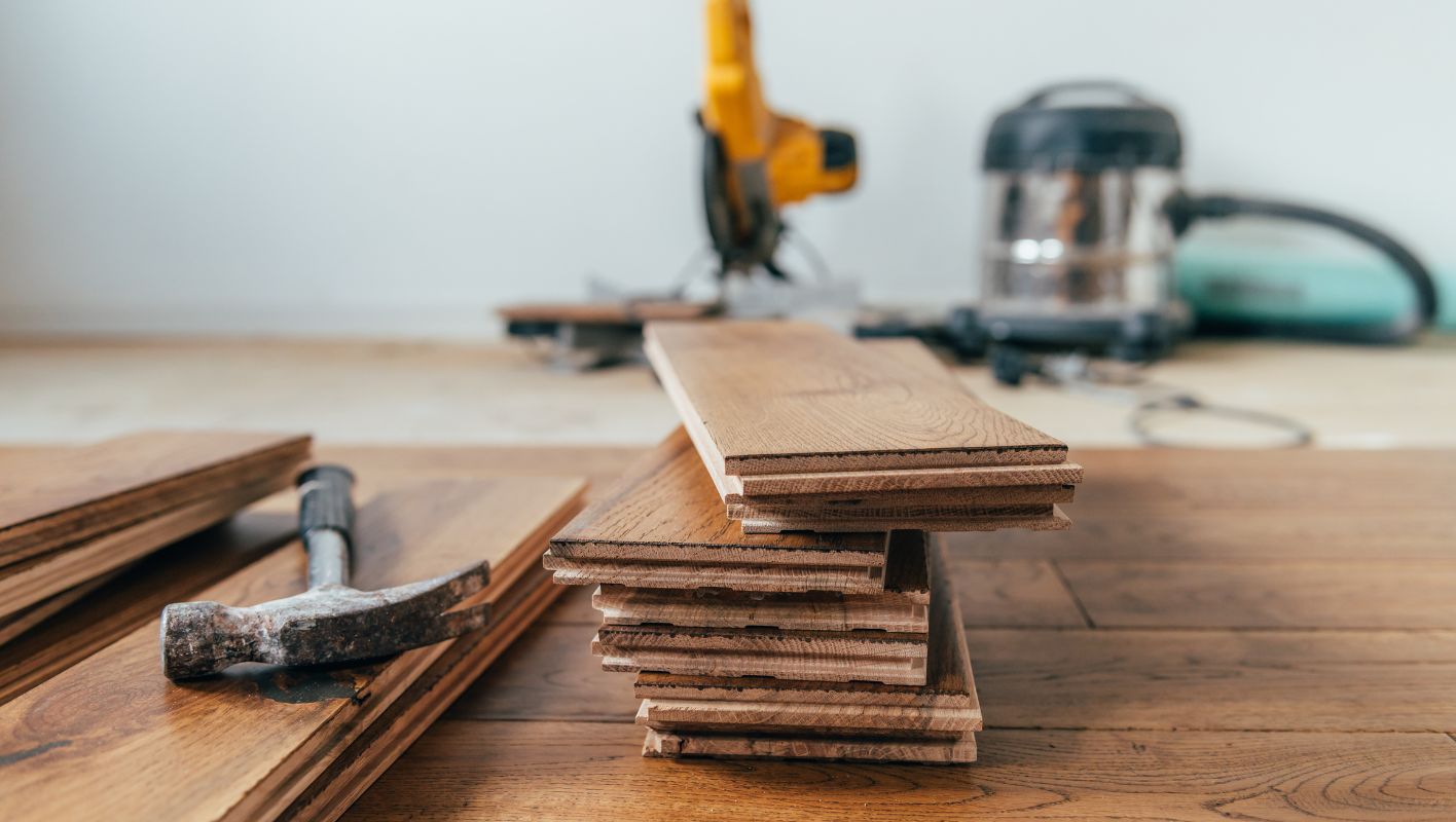 can install wood flooring over tile