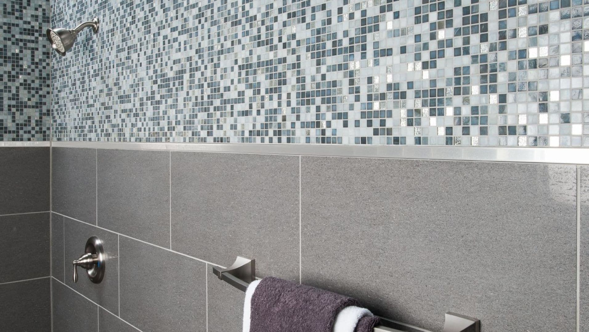 Close-up of a shower installation showcasing tile trim