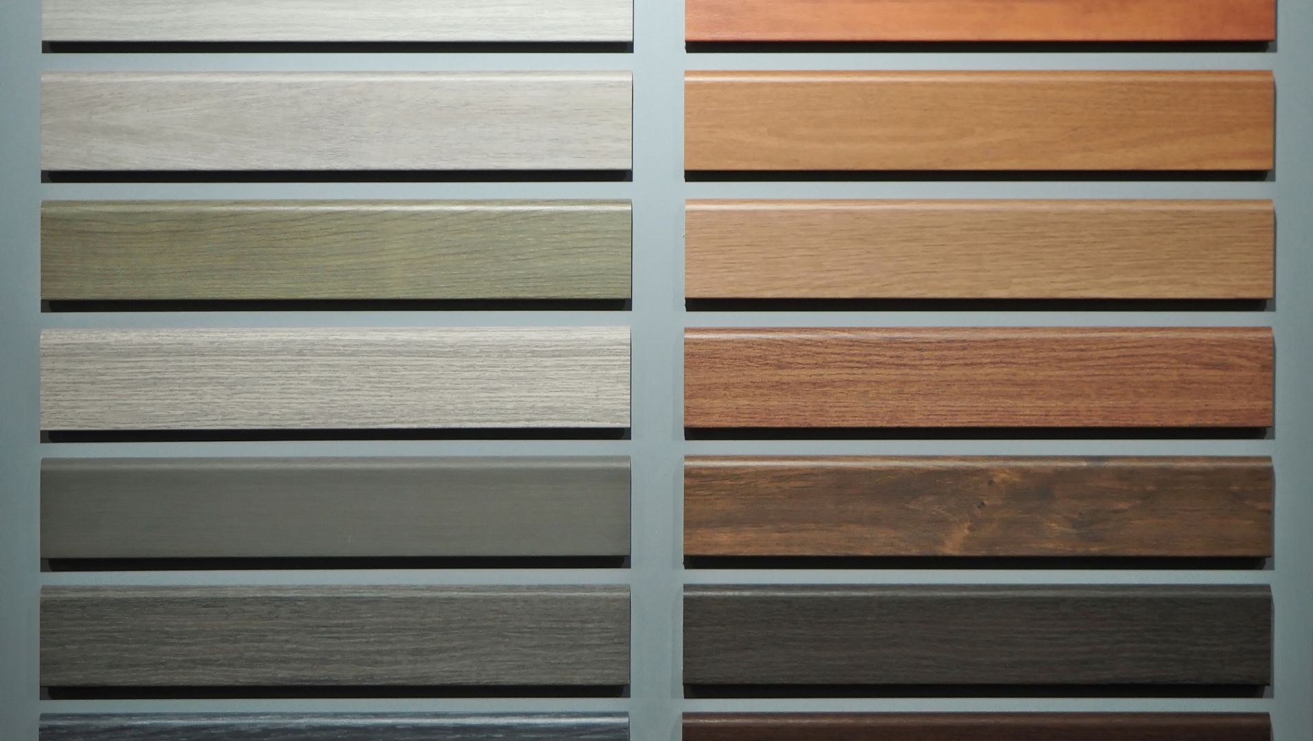A comparison of different skirting board materials: wood, MDF, PVC, and metal.
