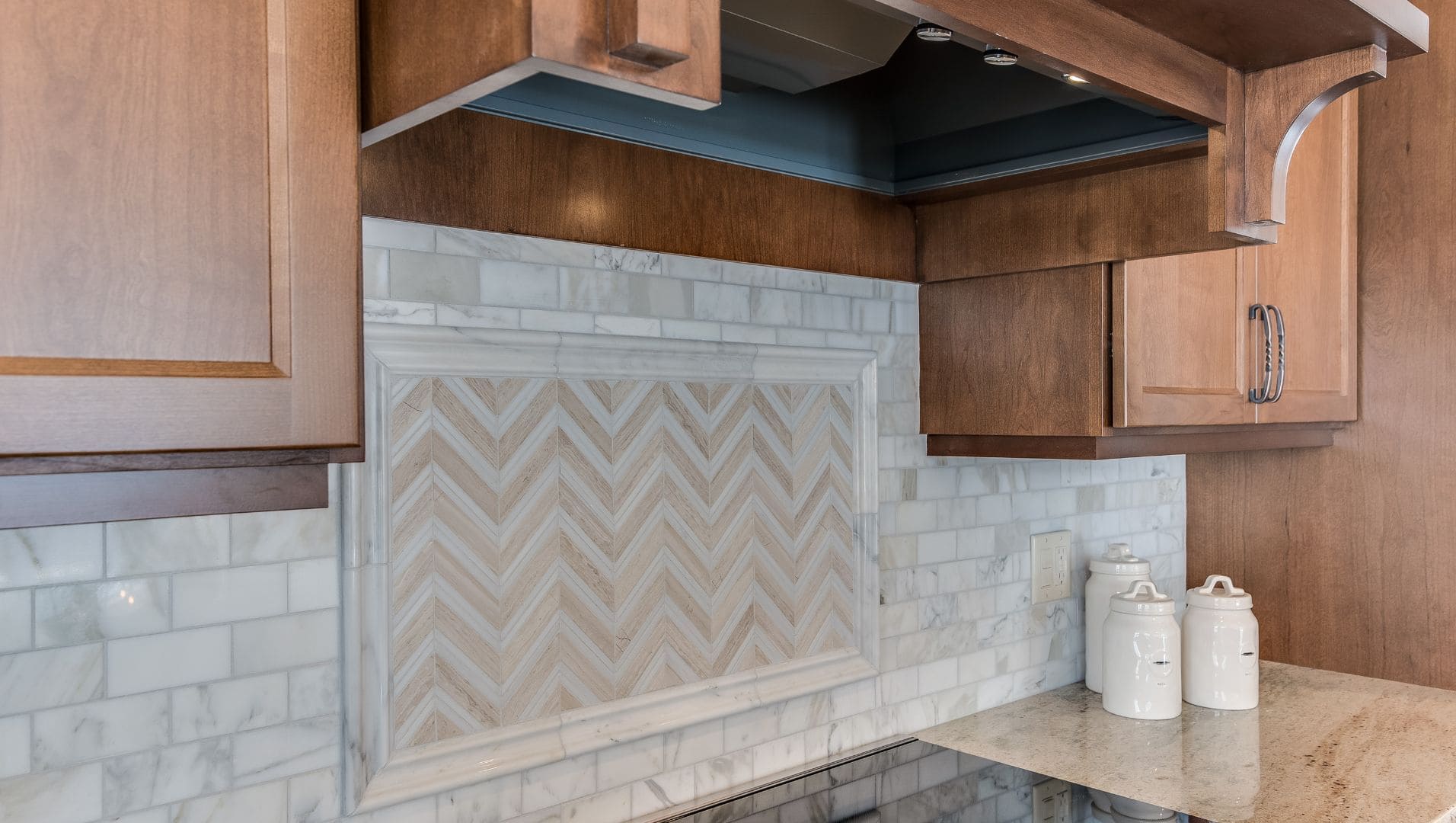 Close-up of a kitchen backsplash with tile trim