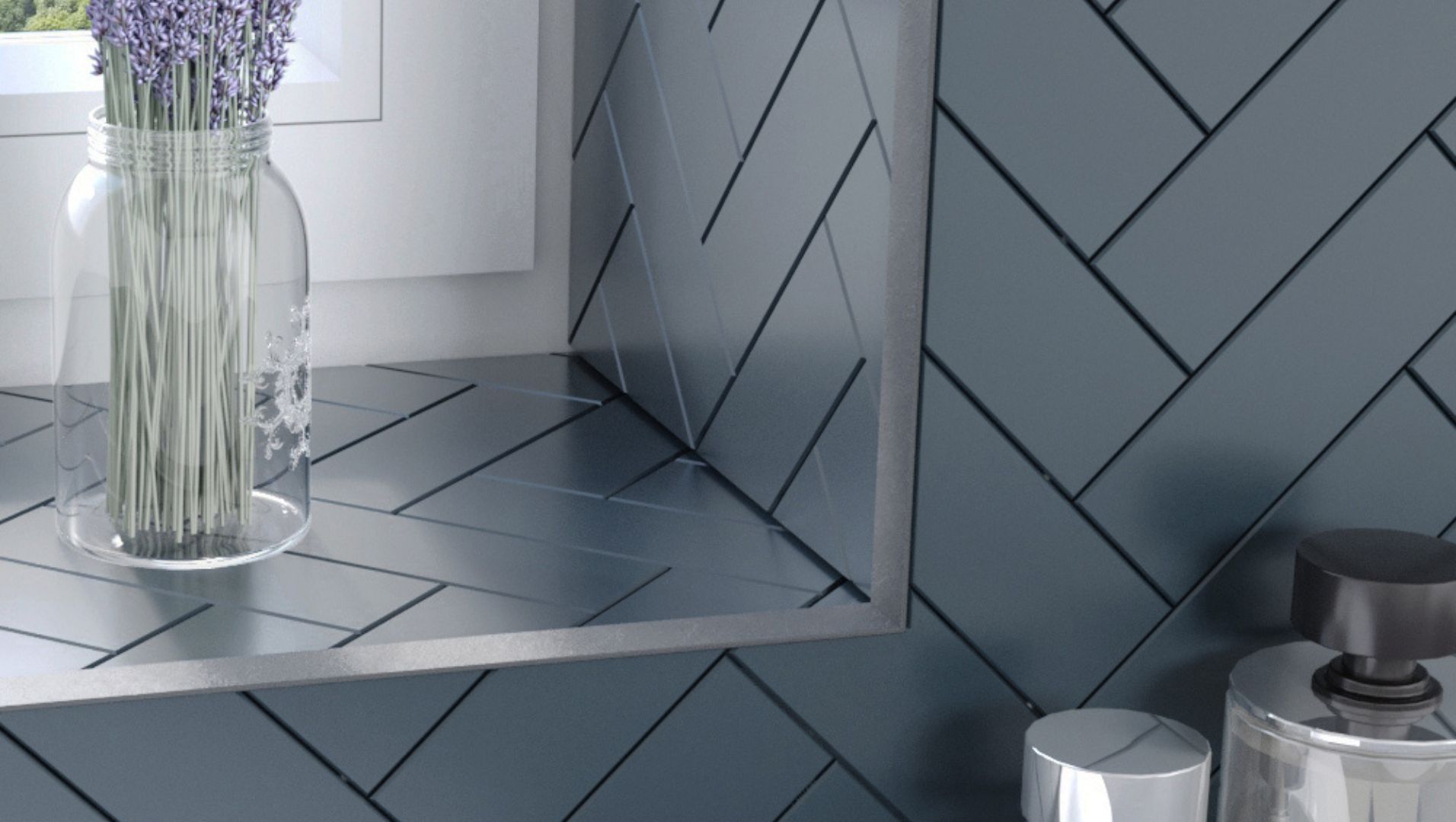Close-up of a tiled wall with metallic tile trim
