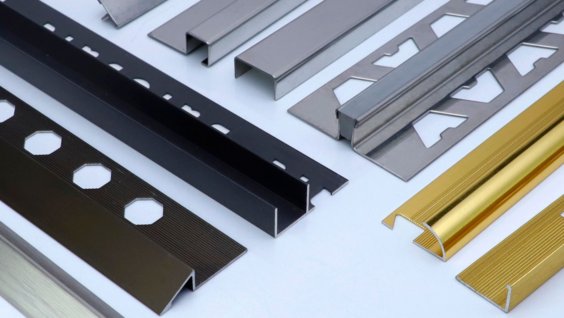 Various tile trim materials: aluminum, PVC, and stainless steel