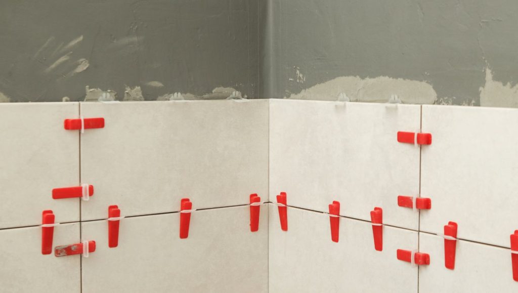 use tile leveling system on walls