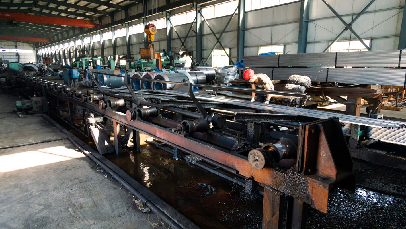 extruding steel and iron